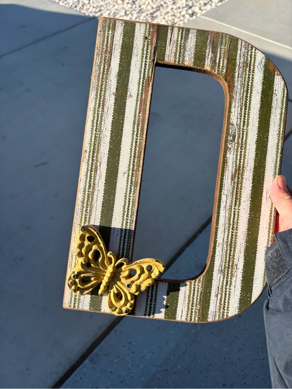 Striped Green and White Decorative Letter D with Yellow Butterfly Accent